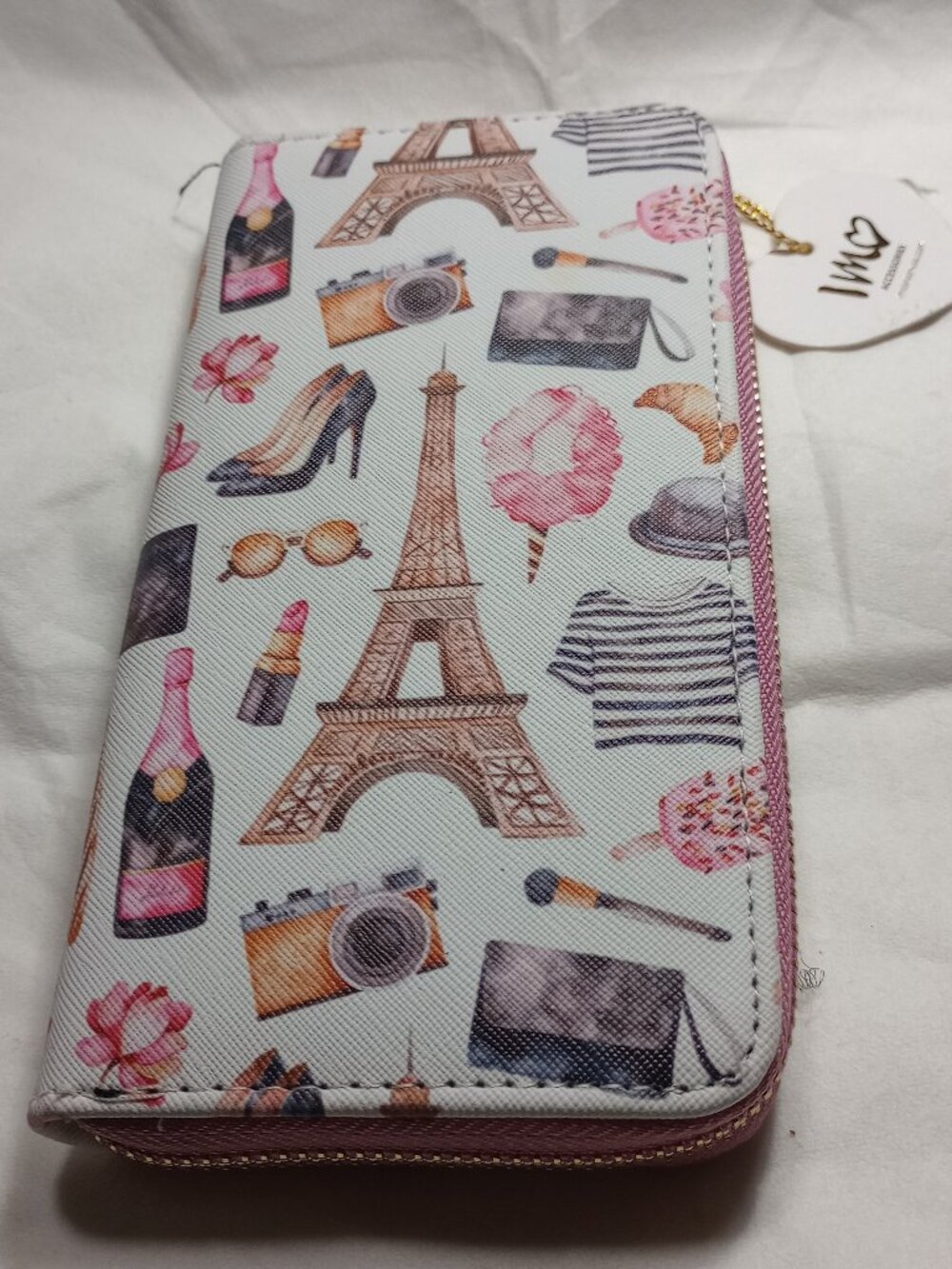 IMO FASHION WALLET, GOLD TONE ZIP AND CLOSURE TAB.